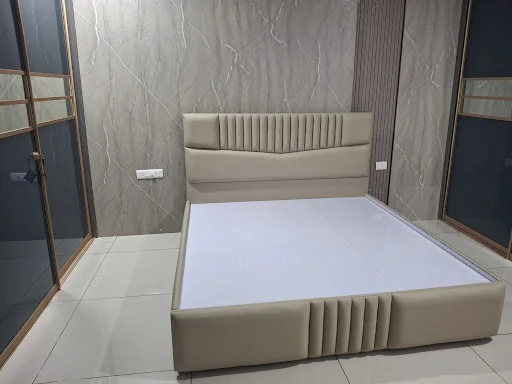 Beige upholstered bed with a fluted headboard and footboard, shared with Aashish Reddy’s review
