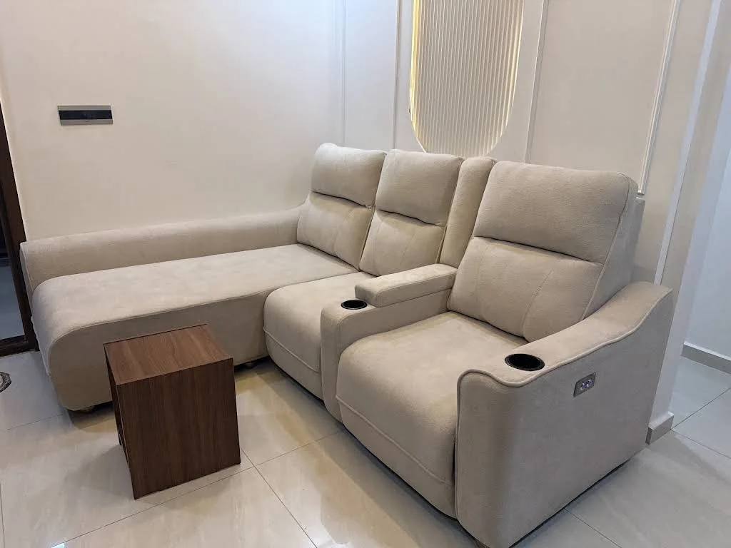 Beige reclining sofa with cupholders and a wood table, shared with Ravi Kumar’s review