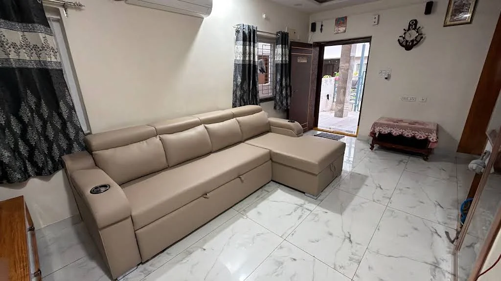 Wide view of a beige chaise sofa, shared with Sai Sirisha’s review