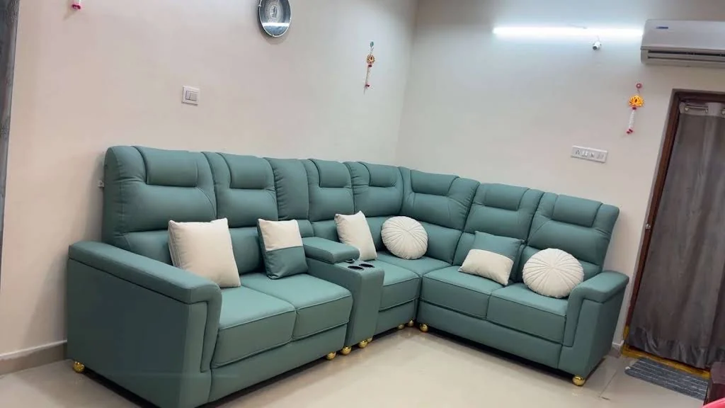 Full room view of a teal sectional sofa, shared with Sushma T’s review